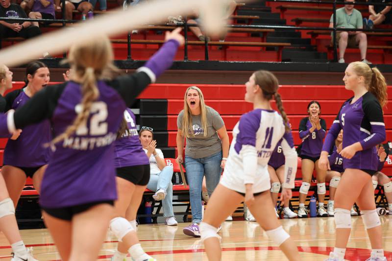 Manteno head coach Alexis Hosselton celebrates with the team after a point during the Panthers' victory in three sets over Bradley-Bourbonnais, 25-21, 23-25, 25-17, on Monday, Sept. 15, 2025.