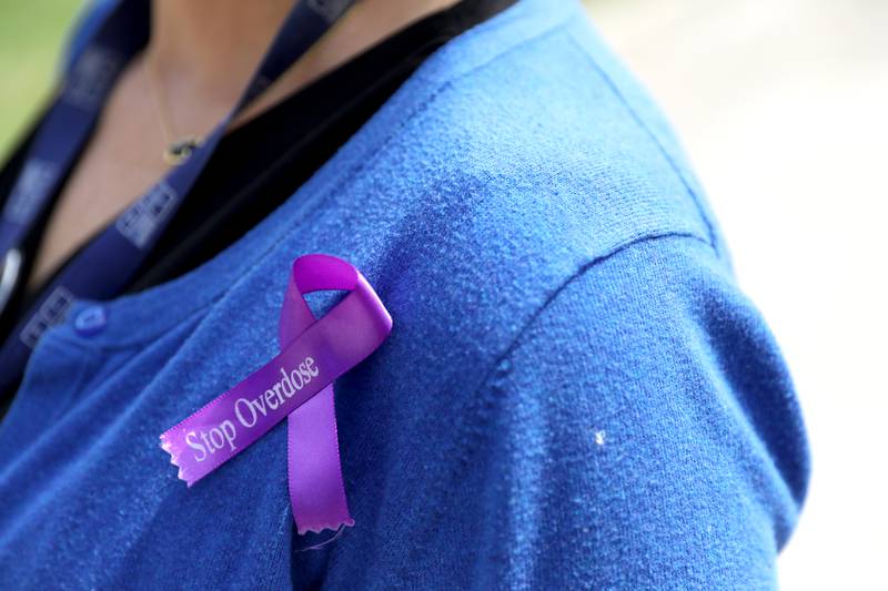 Karen Wolownik Albert, chief executive officer at Recovery Centers of America in St. Charles, wears a ribbon in honor of International Overdose Awareness Day, which is Aug. 31.