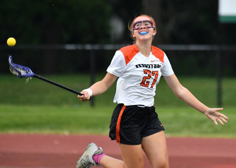Crystal Lake’s Anna Starr flips the ball away with glee as the clock runs out on the Benet Supersectional game against Downers Grove South on June 3, 2025 at College of DuPage in Glen Ellyn.