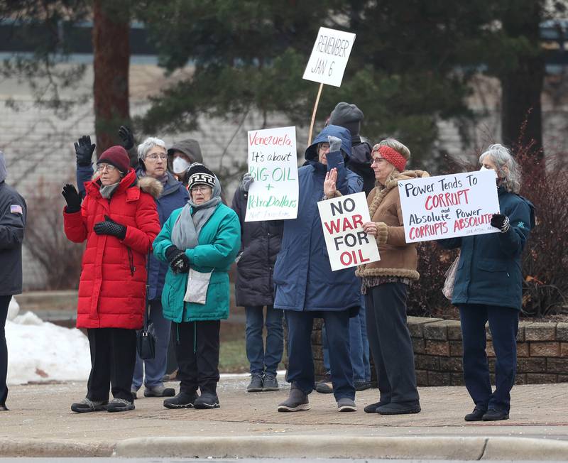 Protesters gathered Tuesday, Jan. 6, 2026, for a Venezuela Rapid Response Rally at Memorial Park on the corner of First Street and Lincoln Highway in DeKalb, to voice their opposition to President Donald Trump and the administrations recent actions in Venezuela.