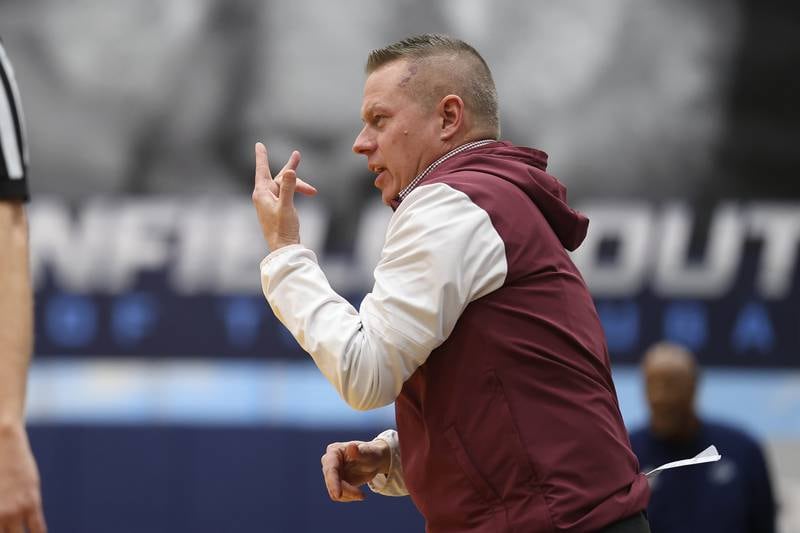 Morris head coach Joe Blumberg call in plays against Plainfield South on Wednesday, Jan. 28, 2026 in Plainfield.