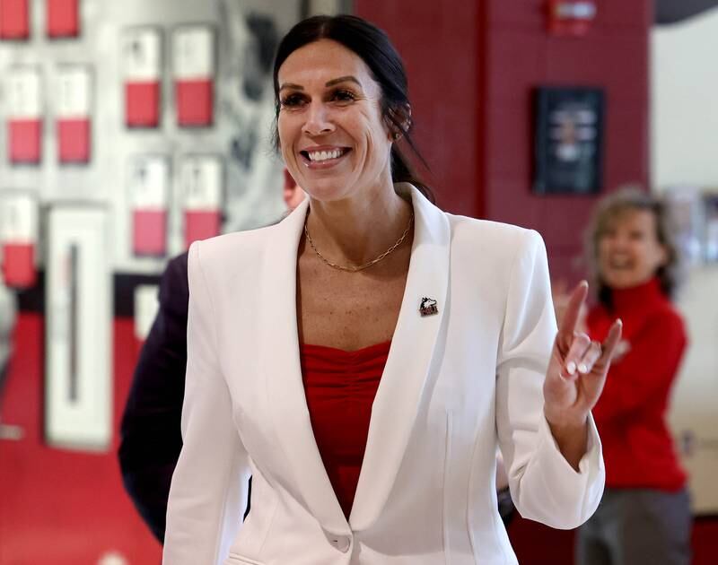 Jacey Brooks enters the press conference Wednesday, April 9, 2025, in the Convocation Center at Northern Illinois University, where she was announced as the new NIU women’s basketball coach.