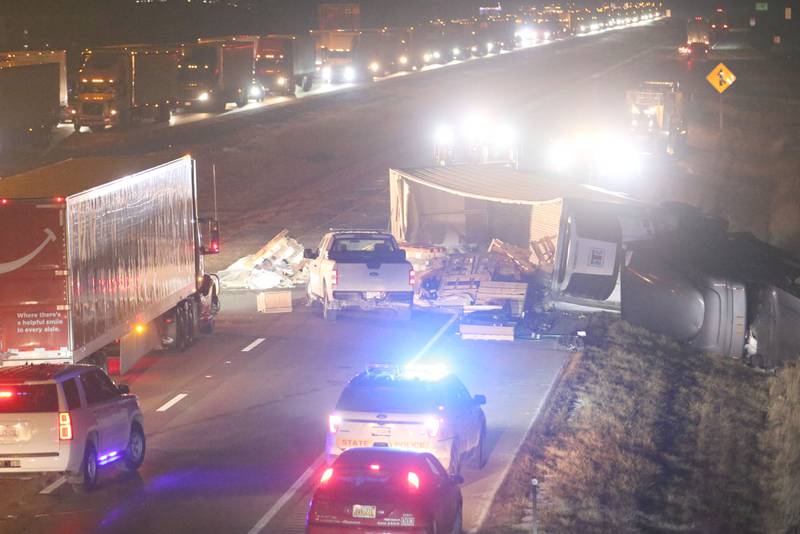 A wrecker removes a semi truck that tipped over on it's side on Thursday, Jan. 9, 2024 near the Spring Valley exit on Interstate 80 near Ladd. A cattle hauler tipped over allowing cows to roam on Interstate 80.