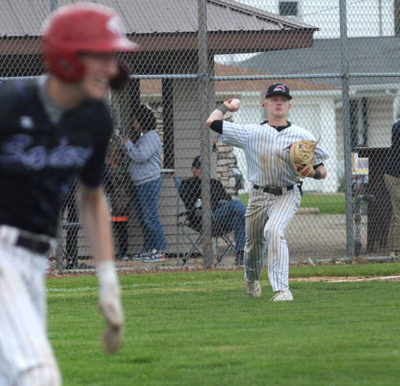 Fulton's Dane Van Zuiden fields a grounder and prepares to throw out the Rockford Lutheran runner at the 1A Lena-Winslow Sectional on Wednesday, May 28, 2025.
