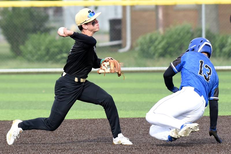 Bishop McNamara's Taylor Fuerst, left, throws to first base after forcing Central's Kaden LaFine out at second base during the Class 2A Herscher Regional semifinals Thursday, May 22, 2025.