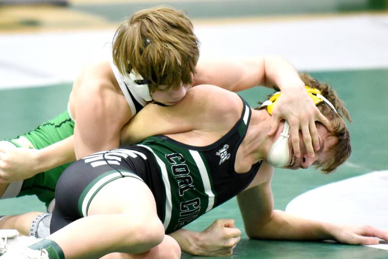Coal City's Jason Piatak, right, attempts to escape the grasp of Seneca's Raiden Terry during the 106-pound third-place match at the IHSA Class 1A Coal City Sectional Saturday, Feb. 15, 2025.