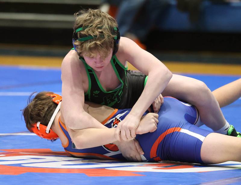 Rock Falls’ Scottie Hampton works to turn Genoa-Kingston's Sullivan Bresnen Thursday, Jan. 16, 2025, during their 106 pound match at Genoa-Kingston High School.