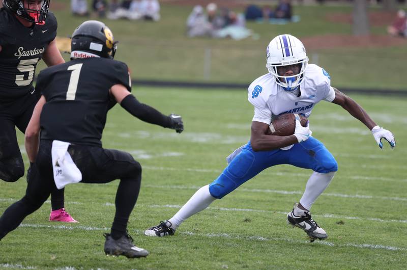 St. Francis' Ian Willis looks to get by Sycamore's Colton Sharpness Saturday, Nov. 16, 2024, during their Class 5A quarterfinal game at Sycamore High School.