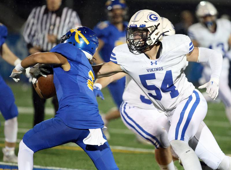 Geneva's Derek Verdone (54) reaches for Lake Forest's Nathan Williams (2) during the IHSA Class 6A playoff game Friday November 3, 2023 in Lake Forest.