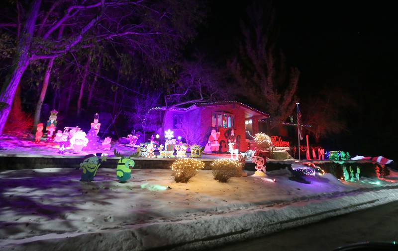 Christmas lights and cutouts  fill the lawn of a home in the 3200 block fo Carrie Street on Wednesday, Dec. 17, 2025 in Peru.