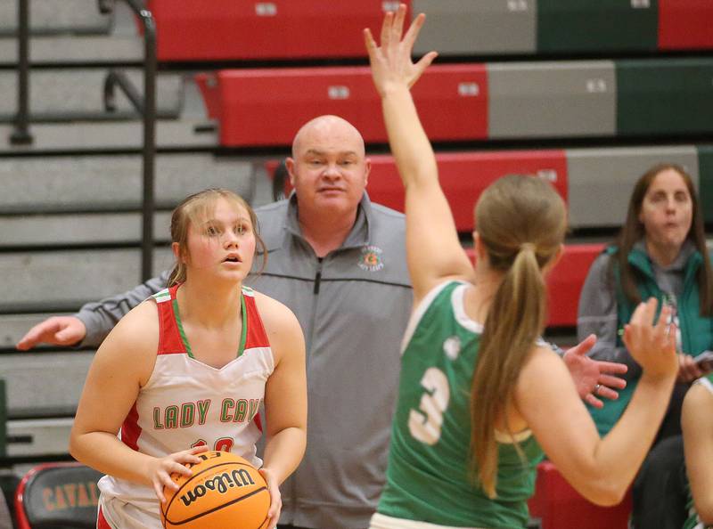 L-P's Ashley Kawiecki fakes a jump shot over Geneseo's Lily Taylor on Tuesday, Feb. 4, 2025 in AJ Sellett Gymnasium at L-P High School.