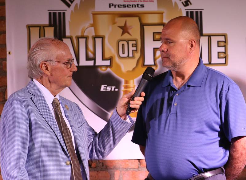 Tom Pocivasek is interviewed by  Lanny Slevin for the  Lifetime Achievement Award on behalf of his father John Pocivasek during the Shaw Media Illinois Valley Sports Hall of Fame on Thursday, June 8, 2023 at the Auditorium Ballroom in La Salle. John Pocivasek, had a star prep career at St. Bede Academy and was a legendary figure who was a multi-sport coach and athletic director at Marquette Academy for 38 years.