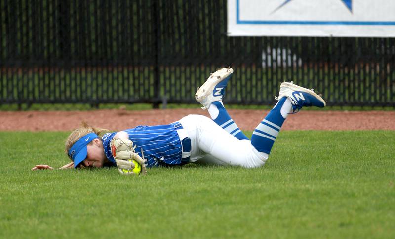 St. Charles North's Ivy Gleeson makes a diving catch in right field during a game against St. Charles East on Friday, April 25, 2025 at St. Charles North.