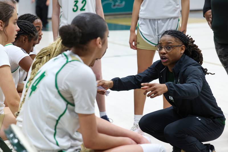 Bishop McNamara head coach Khadaizha Sanders talks to her team in a timeout during Bishop McNamara's 60-36 victory over Reed-Custer in the IHSA Class 2A Bishop McNamara Regional semifinals on Monday, Feb. 16, 2026.