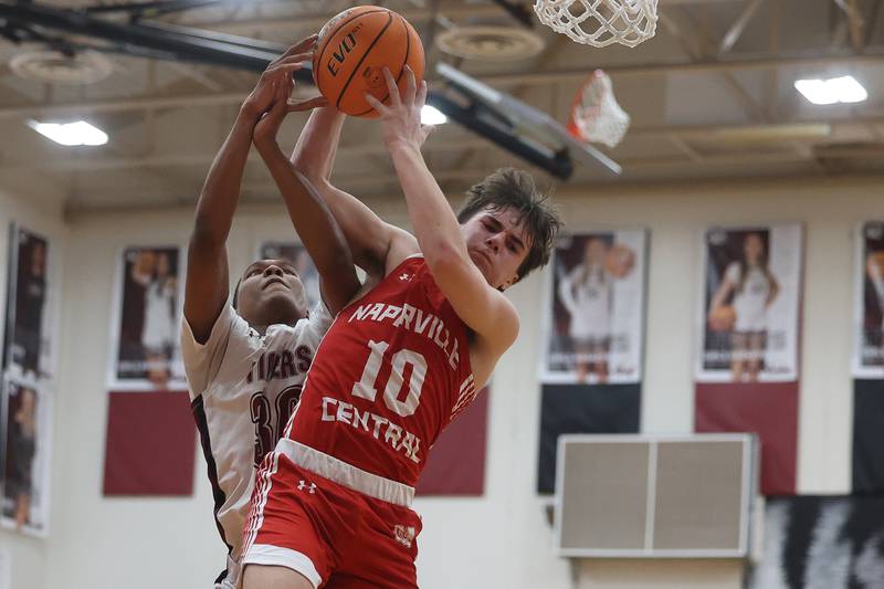 Naperville Central’s Cooper Page pulls in the rebound against Plainfield North on Wednesday, Jan 22, 2025 in Plainfield.