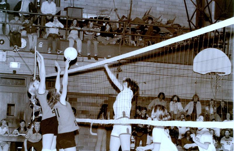 Becky Norton takes a swing for Princeton playing for the 1975-76 Tigresses volleyball team in the "Girls Gym," now known as the South Gym. The team, which was founded in 1973, started playing its first games in Prouty Gym in 1979. The 2023 season marks the 50th season of Princeton High School volleyball.