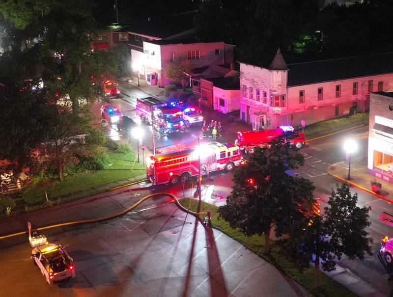 Firefighters gather at Walnut and 5th Streets to fight a fire across from the Westclox building on Friday, July 14, 2023 in Peru. The fire began at 8:19p.m. A MABAS box alarm was issued to the fourth level and then brought back down after the fire was contained.