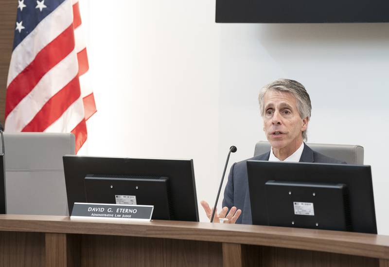 Administrative law judge David Eterno presides over an adjudication court hearing on Friday, Sept. 1, 2023 at the Cary Municipal Center regarding fireworks being used in a Cary neighborhood.
