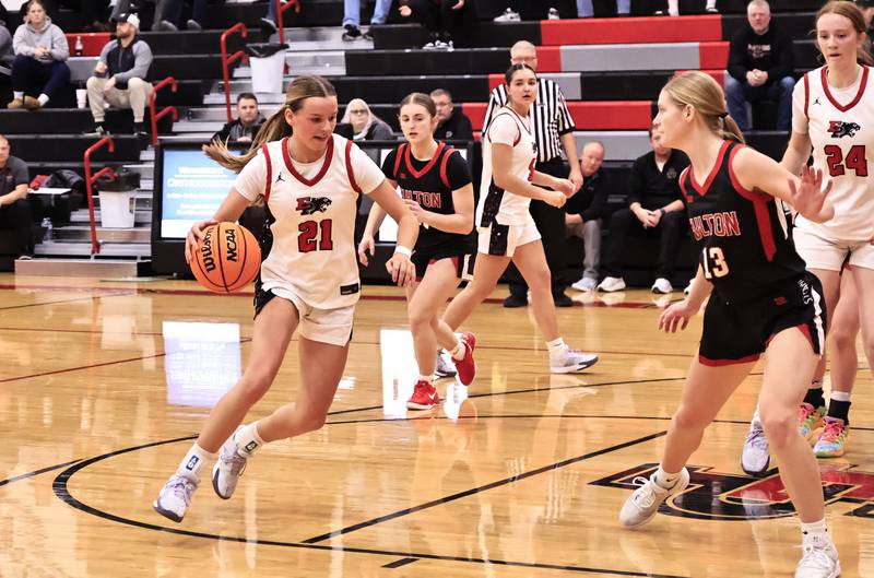 EP's Aubrey Huisman powers her way up the center of the court past Fulton’s Haley Smither Tuesday as the Panthers hosted the Fulton Steamers in Erie.