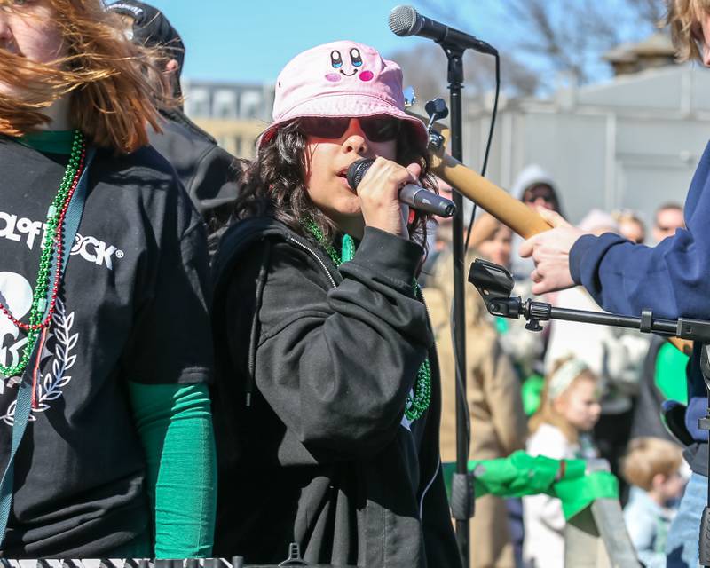 Students with the Lemont School of Rock perform on a float in the Lemont St. Pat's Day Parade on Saturday, March 8, 2025  in Lemont.