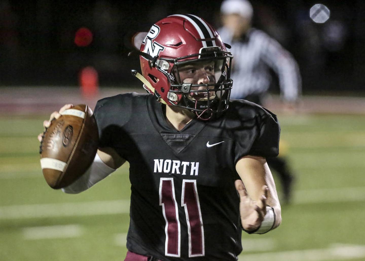 Plainfield North's Adam Smith looks for a play through Minooka's defense Friday, Oct. 4, 2019, at Plainfield North High School in Plainfield, Ill. The Indians shut out the Tigers, 34-0.