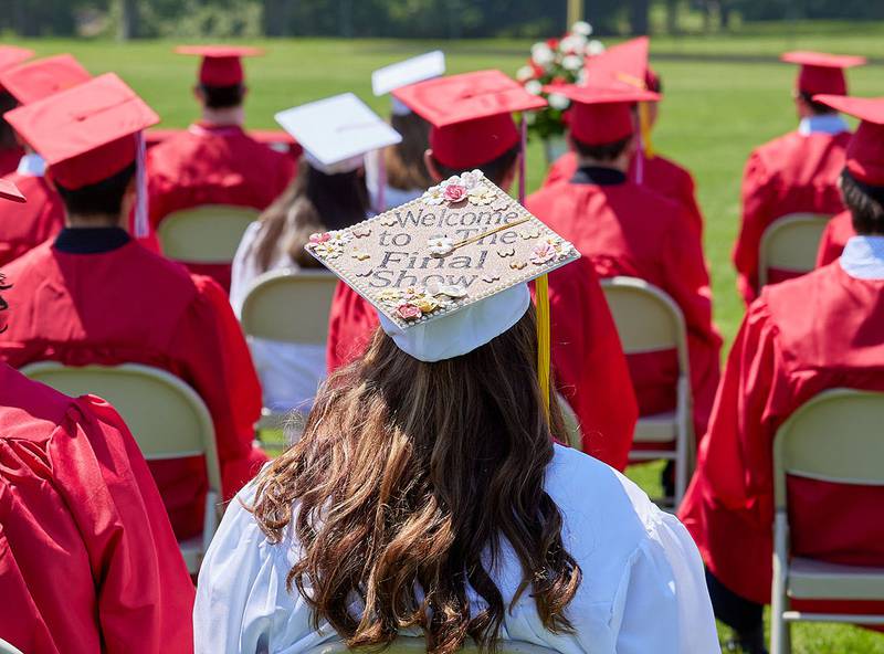 A Hall graduate's cap reads "welcome to the final show" during the graduation ceremony on Sunday May 21, 2023 at Hall Township High School.