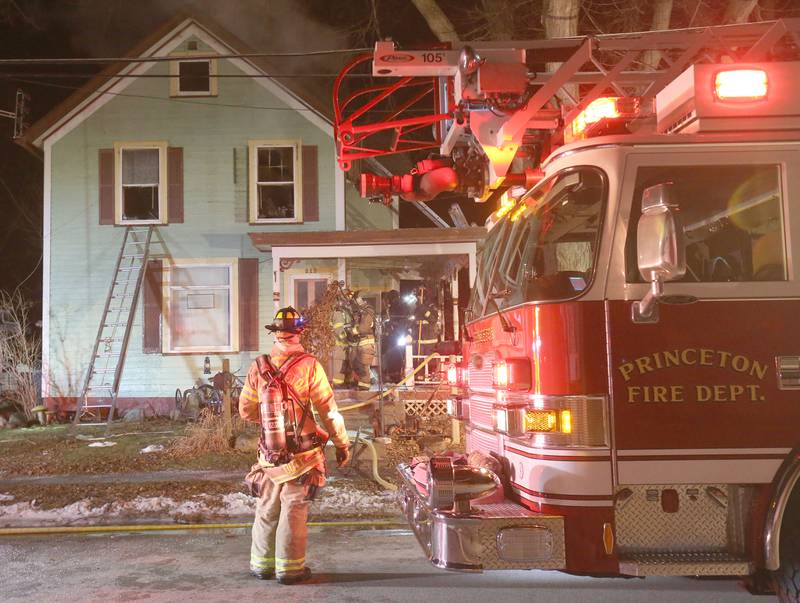 Firefighters work the scene of a structure fire in the 300 block of South Chestnut Street on Friday, Dec. 19, 2025 in Princeton. Fire departments from Malden, Bureau, Walnut, Princeton, Spring Valley, Ladd and Wyanet all responded to the scene.