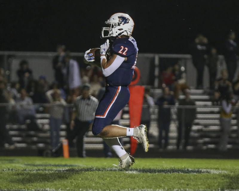 Oswego's Graham Schwab (22) runs in a touchdown during football game between Oswego East at Oswego Friday, Oct 17, 2025 in Oswego.