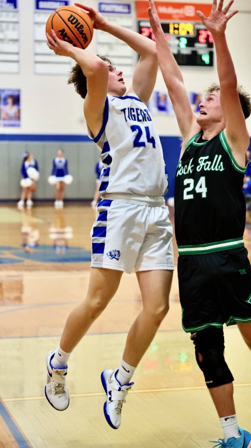 Princeton's Ryan Jagers shoots over Rock Falls' Owen Mandrell in Tuesday's game at Prouty Gym. The Rockets won 61-58.