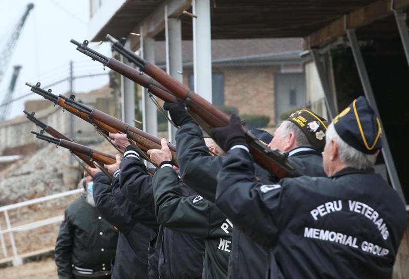 Peru Veterans Memorial Group firing squad performs a 21 gun salute during the 44th annual Pearl Harbor parade and memorial ceremony on Saturday, Dec. 2, 2023 in Peru.