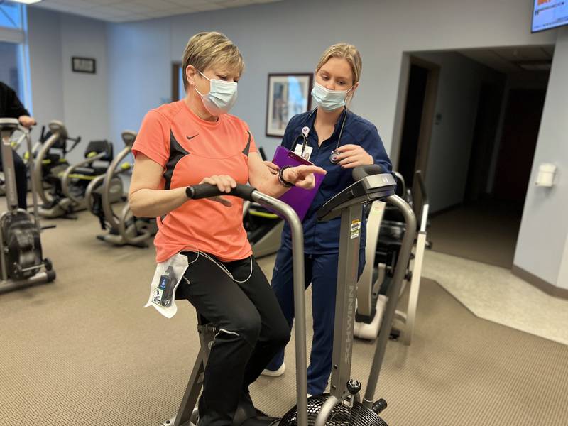 Sue Burton of Geneva exercises at Northwestern Medicine Delnor Hospital’s Cardiac Rehabilitation Program under the guidance of exercise physiologist Jaclyn Lamz.