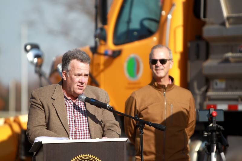 Kane County Board member Mark Davoust, chair of the transportation committee, speaks as Kane County Department of Transportation Director Carl Schoedel looks on before the ribbon cutting for the $12 million realignment of Bliss Road and a new roundabout connecting Bliss Road, Main Street Road and Fabyan Parkway in Blackberry Township on Thursday, Nov. 16, 2023.