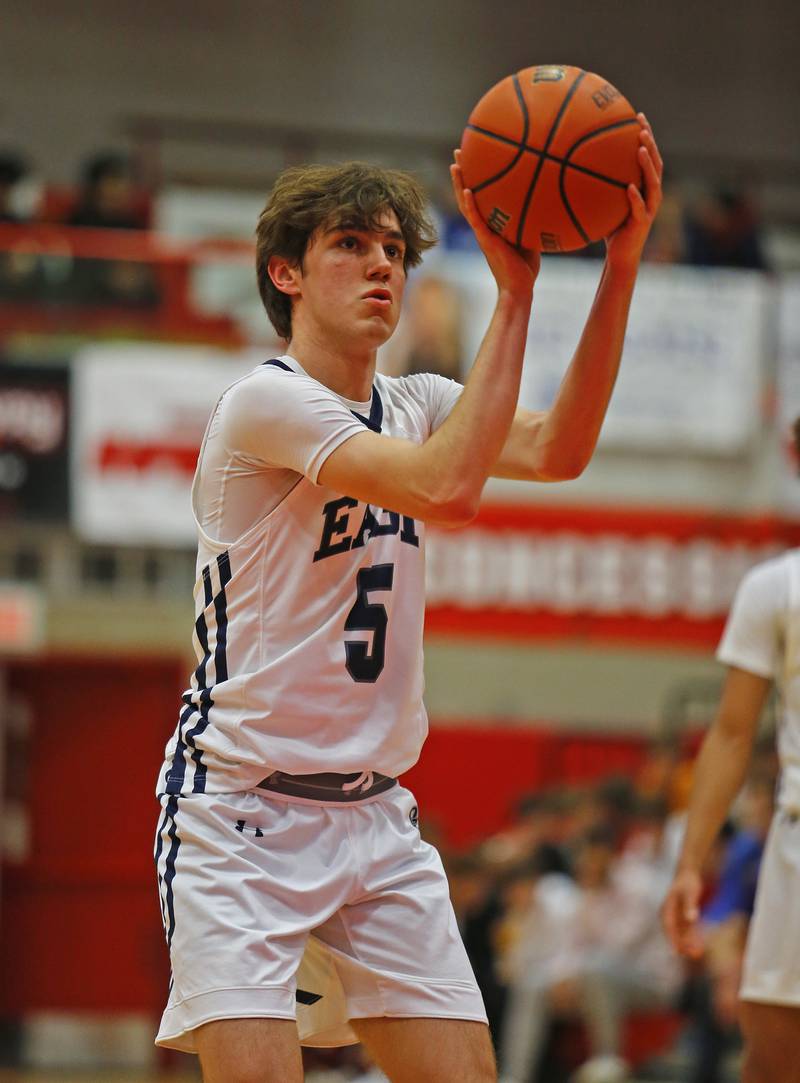 Oswego East's Mason Blanco (5) takes a free throw during the Hinsdale Central Holiday Classic championship game between Oswego East and Hinsdale Central high schools on Thursday, Dec. 29, 2022 in Hinsdale, IL.