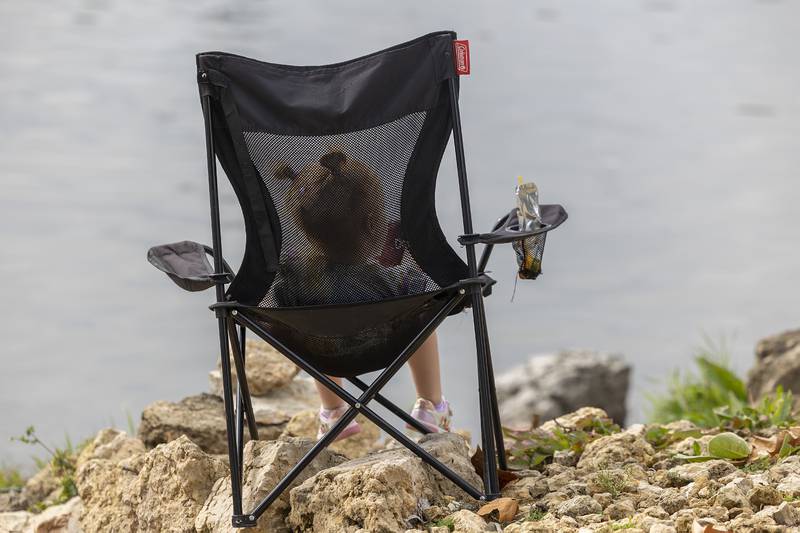Ruby McGinnis, 4, Dixon, has a snack along the Rock River  Saturday, Sept. 20, 2025, while others do the fishing.