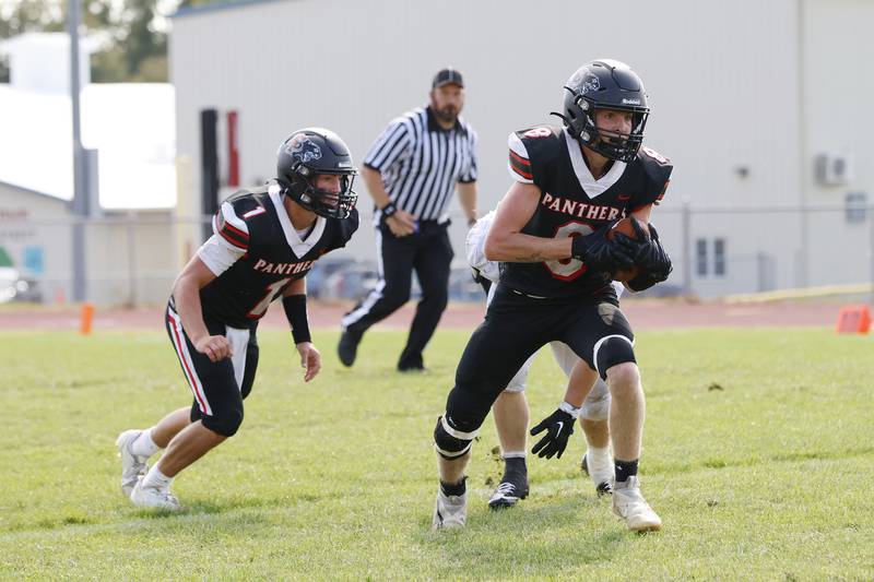 EP's Keegan Winckler (#1) heads in for a block Saturday, Aug. 30, 2025, to help teammate Grayden Church (#8) advance the ball after Church intercepted the ball from the visiting Kewanee team. Although the game was postponed from Friday night due to a weather delay, the Panthers stride wasn't deterred and won the contest 29-6.
