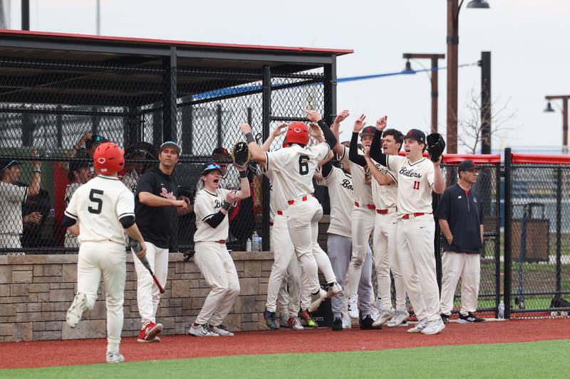 Bradley-Bourbonnais' Clark Six (6) celebrates scoring a run with teammates to pull ahead by two runs in the third inning during the Boilermakers' 8-7 loss to Homewood-Flossmoor on Monday, April 13, 2026.