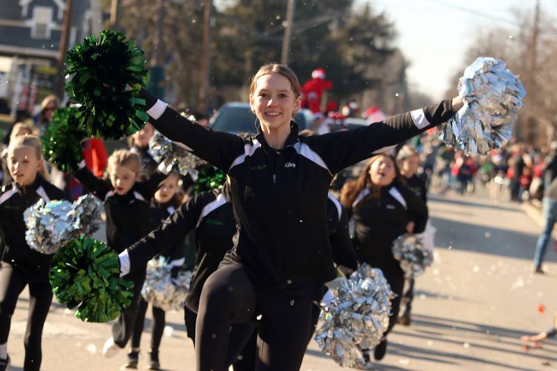 Dancers from the Inspiration Dance Studio march in a parade as part of Merry Cary events Sunday, Dec. 8, 2024 in Cary.