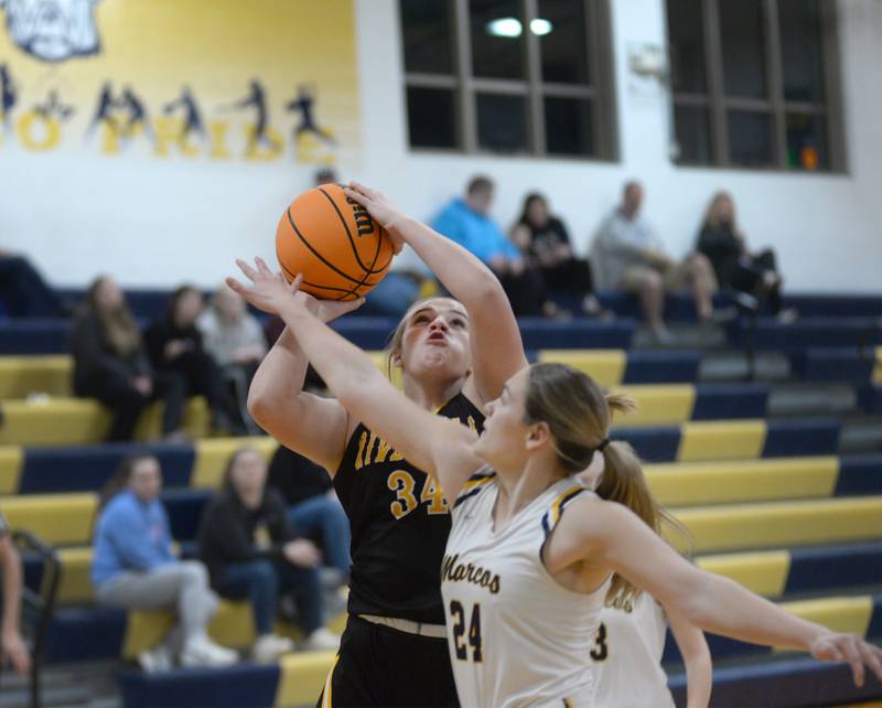 Riverdale's Brooklyn Peterson shoots as Polo's Katelyn Rockwood defends during a Saturday, Jan. 18, 2025 game at Polo High School.
