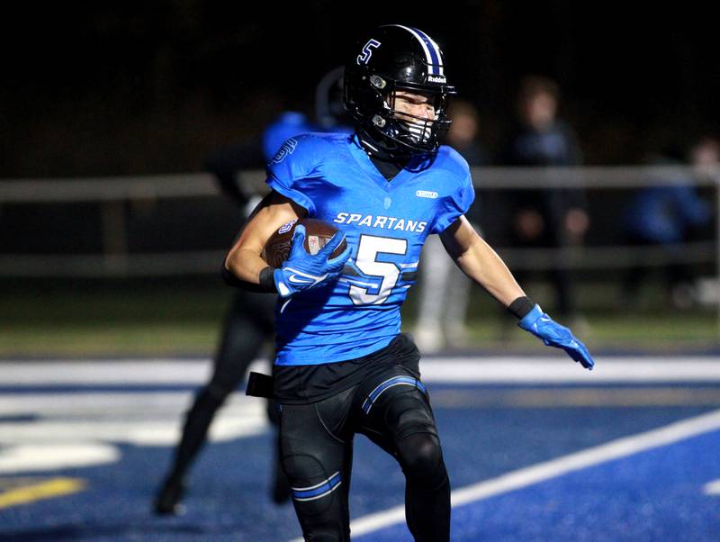 Zach Washington of St. Francis carries the ball for a touchdown during a Class 5A first-round game against Sterling on Friday, Nov. 1, 2024 in Wheaton.