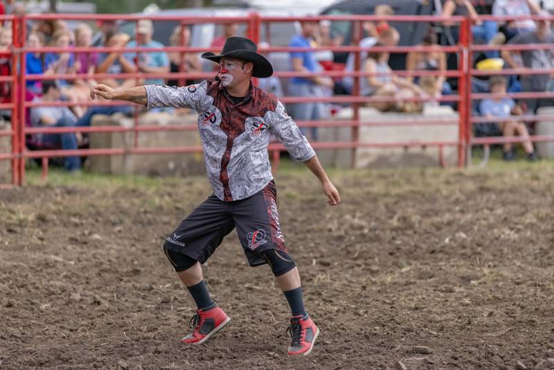 Rodeo bullfighter Mike Wallace entertains the crowd with his jokes and dance moves between events at the LaSalle County 4H Fair rodeo on July 11, 2025 in Ottawa.