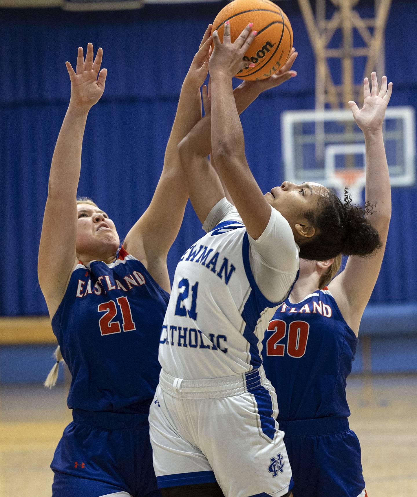 Newman’s Gisselle Martin puts up a shot against Eastland’s Olivia Klinefelter (left) and Tatum Grim Tuesday, Jan. 7, 2025, at Newman High School.