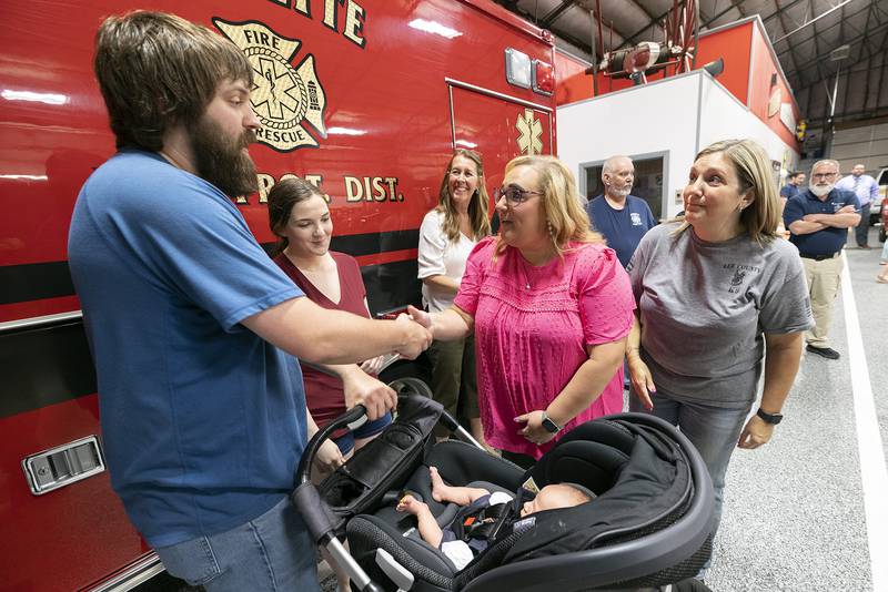 Lee County 911 Dispatchers Kelly Boos (left) and Jesica Knipple meet Ryan and Cheyenne Edwards Thursday, May 15, 2025, at the Sublette Fire Department. Boos and Knipple talked Ryan through unwrapping the umbilical cord as his wife was giving birth to son Wilder.