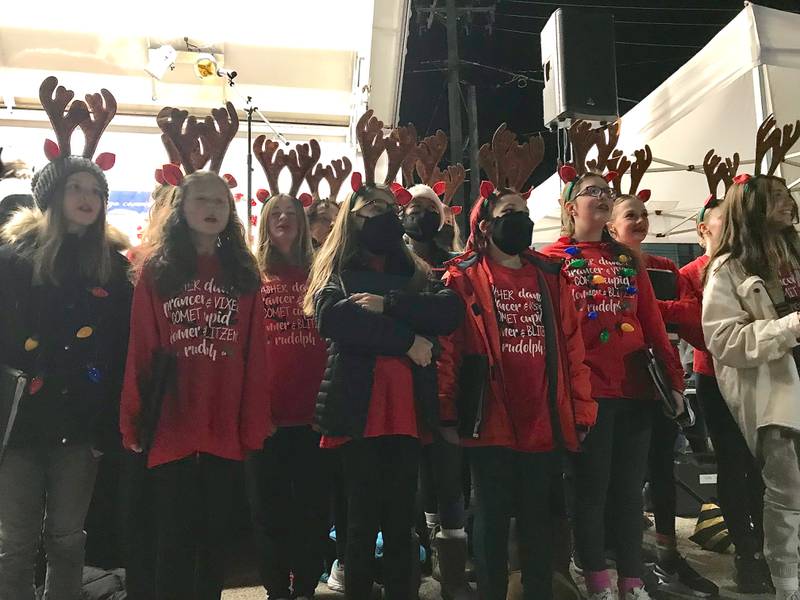 The Traughber Junior High School Choir performed Dec. 3 during the tree lighting ceremony and Christmas Walk celebration in Oswego.