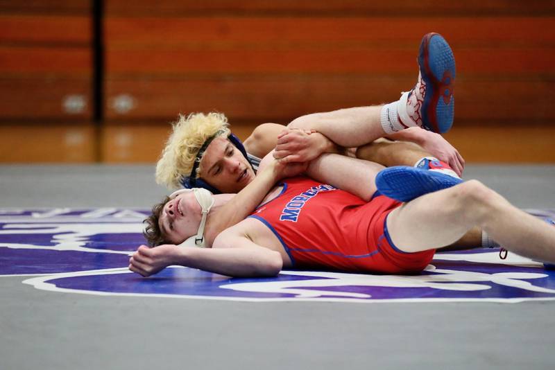 Princeton's Kaydin Gibson looks for a pin against Morrison Thursday night at Prouty Gym.