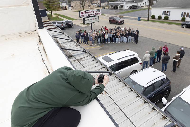 Falan Schwarz positions herself for a group photo Saturday, April 4, 2026, at Oliver’s Corner Market in Dixon.