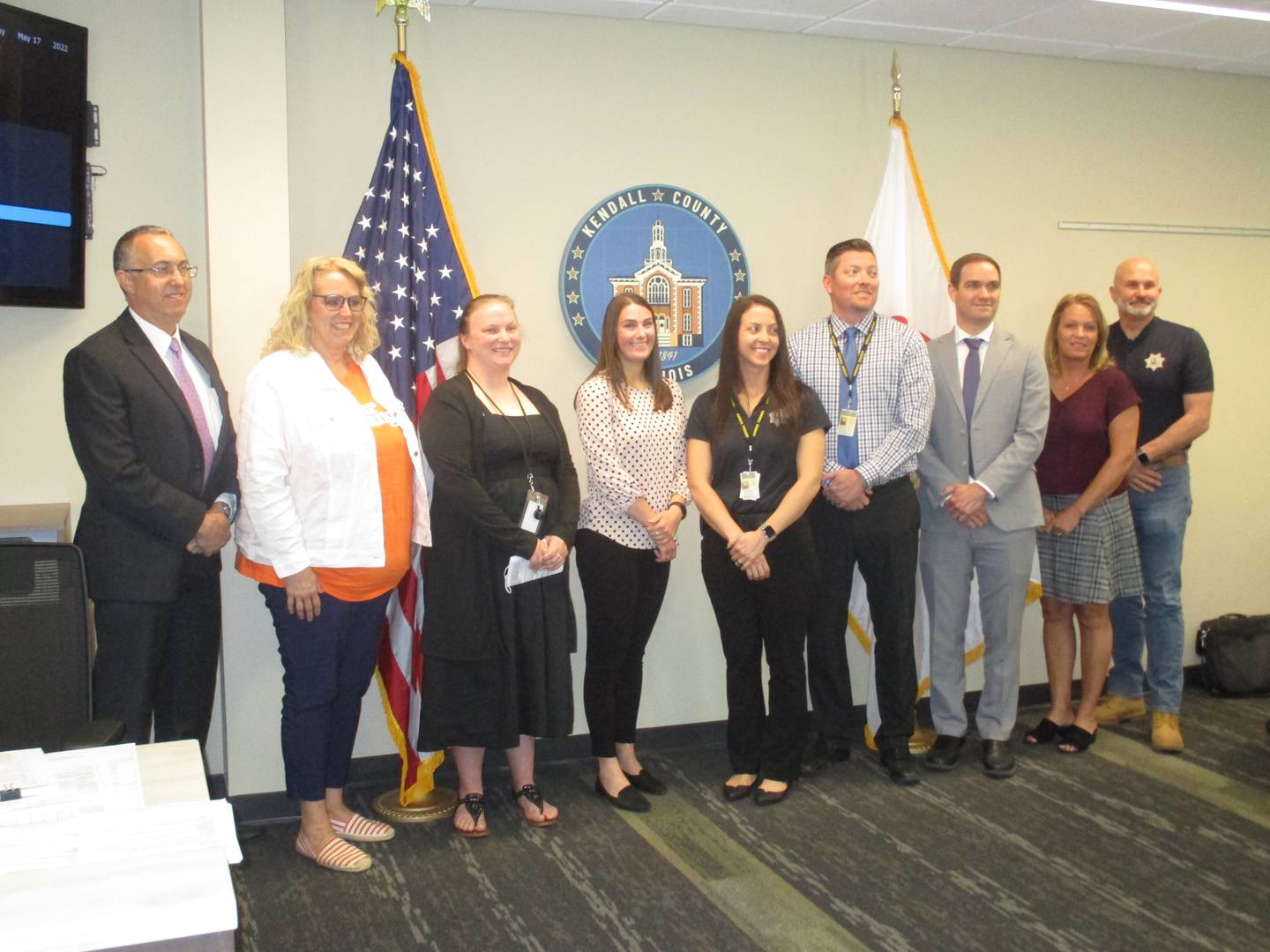 The Kendall County Domestic Violence Response Team appeared before the county board on May 16, 2022. They are, from left, State's Attorney Eric Weis, county board member Robyn Vickers, Health Department Administrative Assistant Jacqueline Szypulinski, Mutual Ground Legal Advocate Jenna Nacht, sheriff's detectives Kasey Stock and Thomas Hagerty, Assistant State's Attorney Ryan Phelps, Health Department Director RaeAnn VanGundy and Sheriff Dwight Baird. (Mark Foster -- mfoster@shawmedia.com)