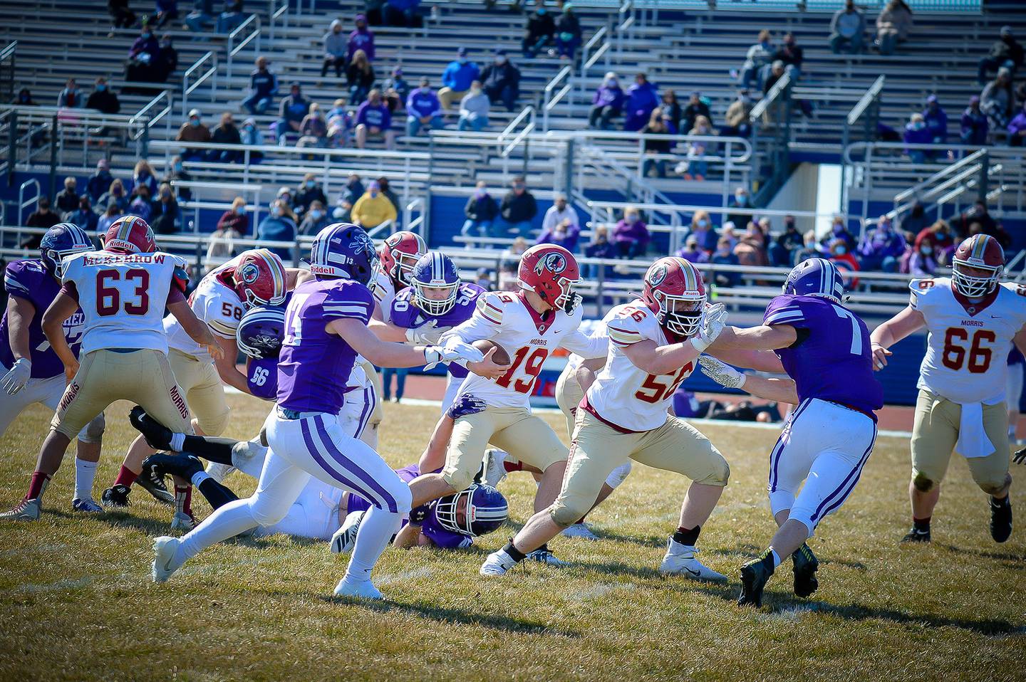 Morris' Zack Romak runs for a gain Saturday in a 27-13 win over Rochelle.