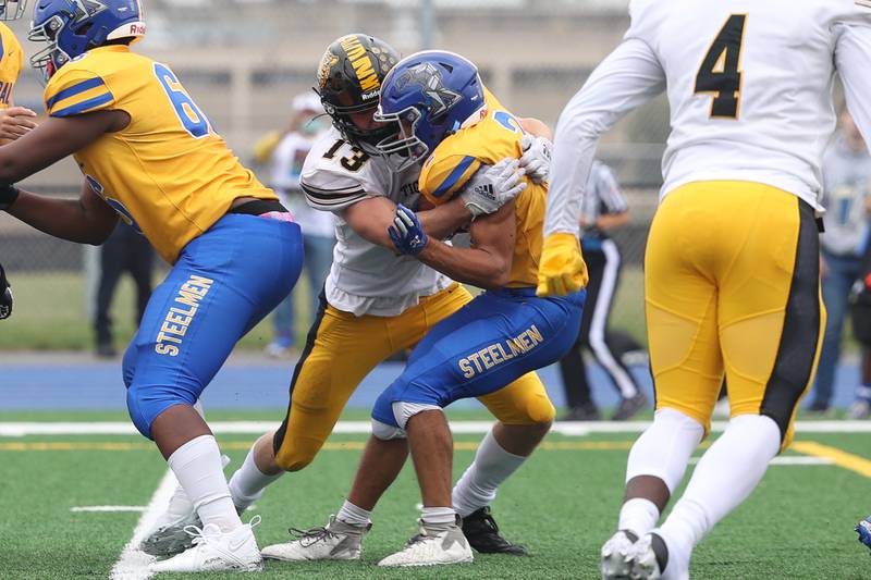 Joliet West’s Thomas Piotrowski tackles Joliet Central’s Christian Smith for a loss on Saturday, Sept. 28, 2024 in Joliet.