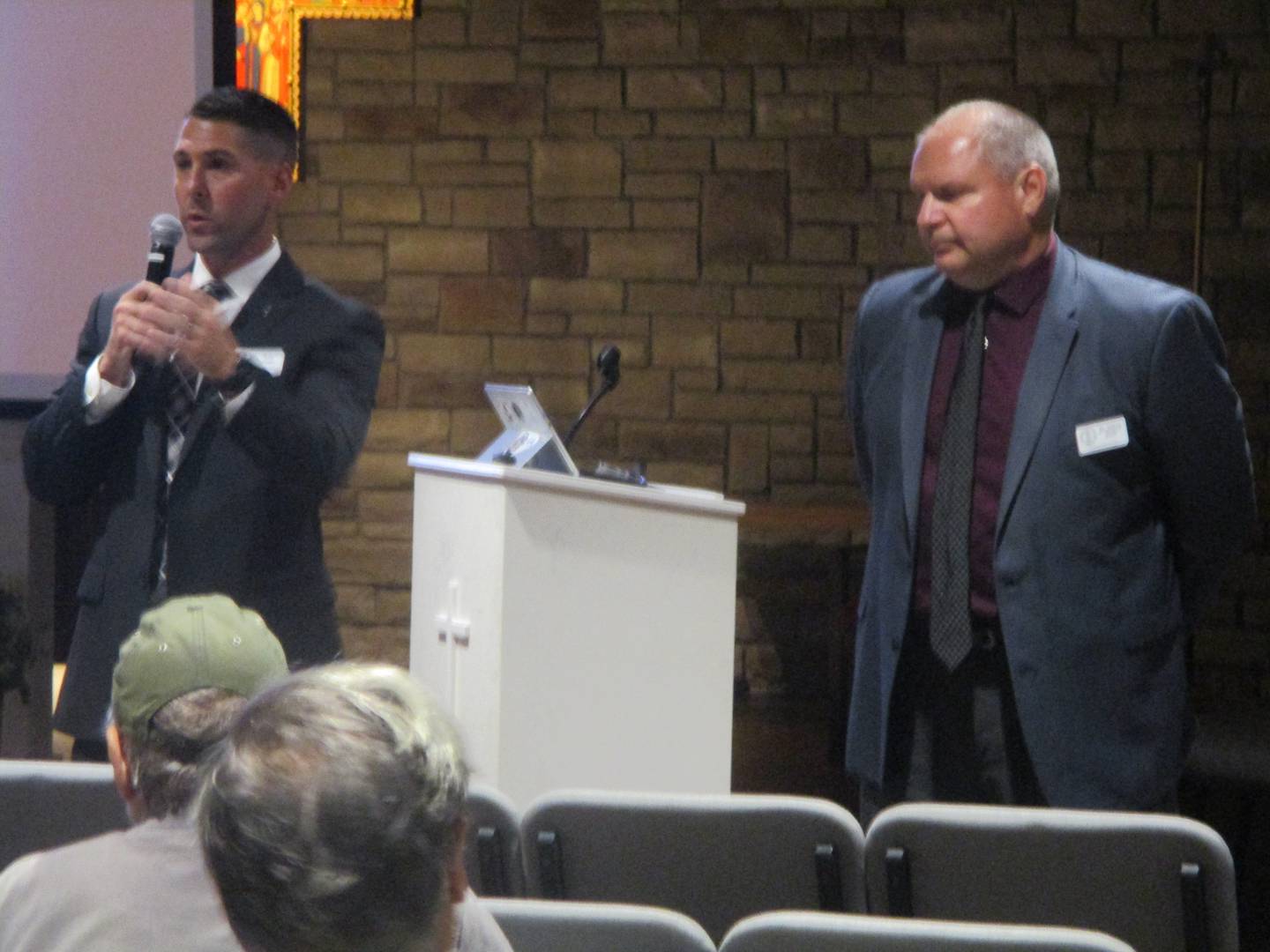 Ryan Quigley (left), institutional advancement director at Joliet Catholic Academy, and Jeff Budz, president and principal at JCA, field questions at a community meeting on Wednesday. Sept. 24, 2025