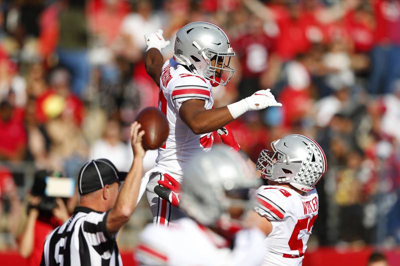 Ohio State running back TreVeyon Henderson (32) celebrates after scoring a touchdown against Rutgers during an NCAA college football game, Saturday, Oct. 2, 2021, in Piscataway, N.J. (AP Photo/Noah K. Murray)